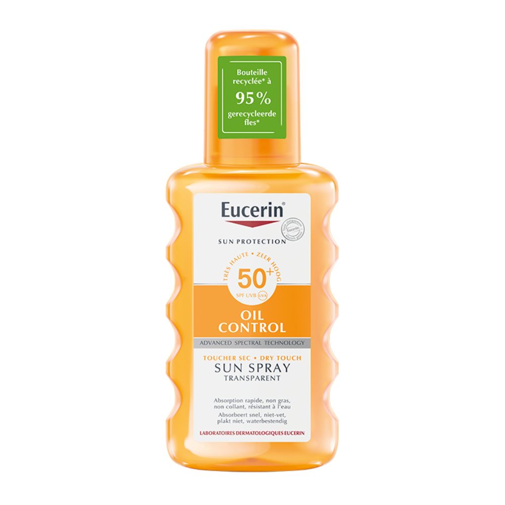 Eucerin Oil Control Dry Touch Sun Spray SPF 50+ in an orange bottle with 95% recycled plastic label.