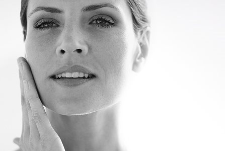 Woman touching her face